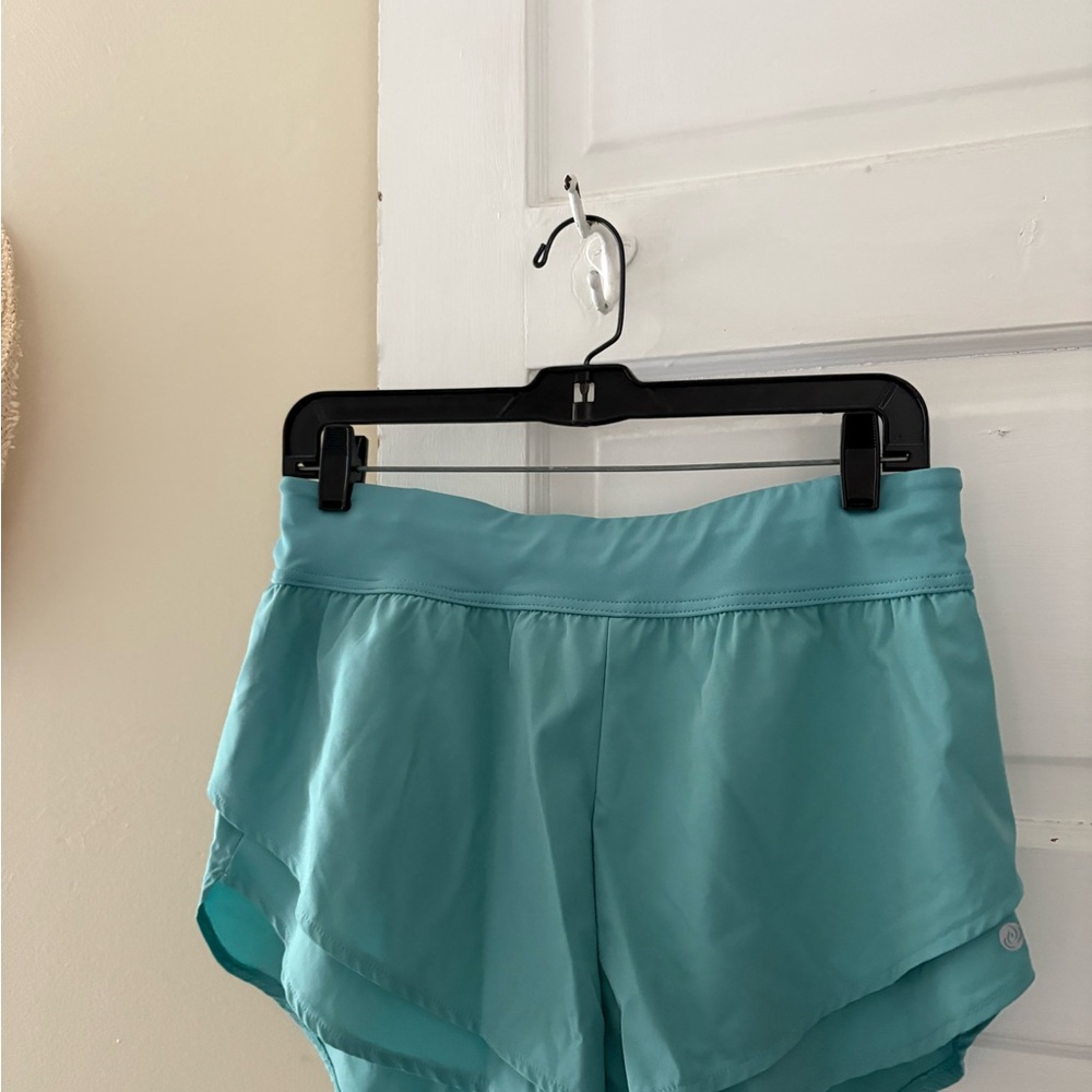 Blue Athletic Shorts with Elastic Waistband and Dolphin Hem